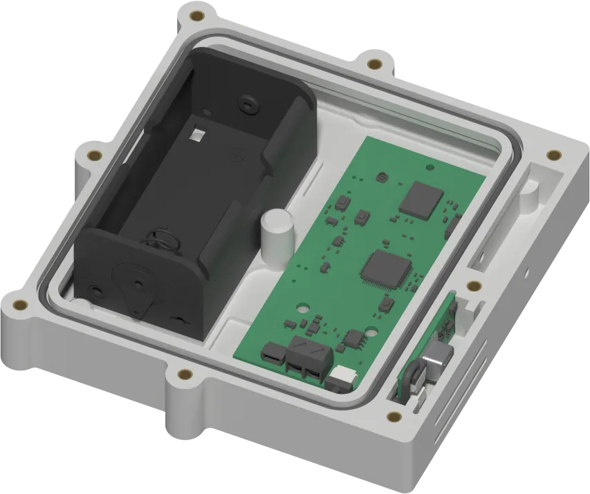 The enclosure with the cover removed: battery holder on the left, main board in the middle, sensor chamber and vent slots on the right.